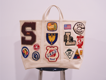 Load image into Gallery viewer, Patched Steel Bag | History Preservation Group
