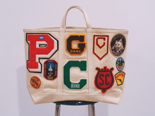 Load image into Gallery viewer, Patched Steel Bag | History Preservation Group
